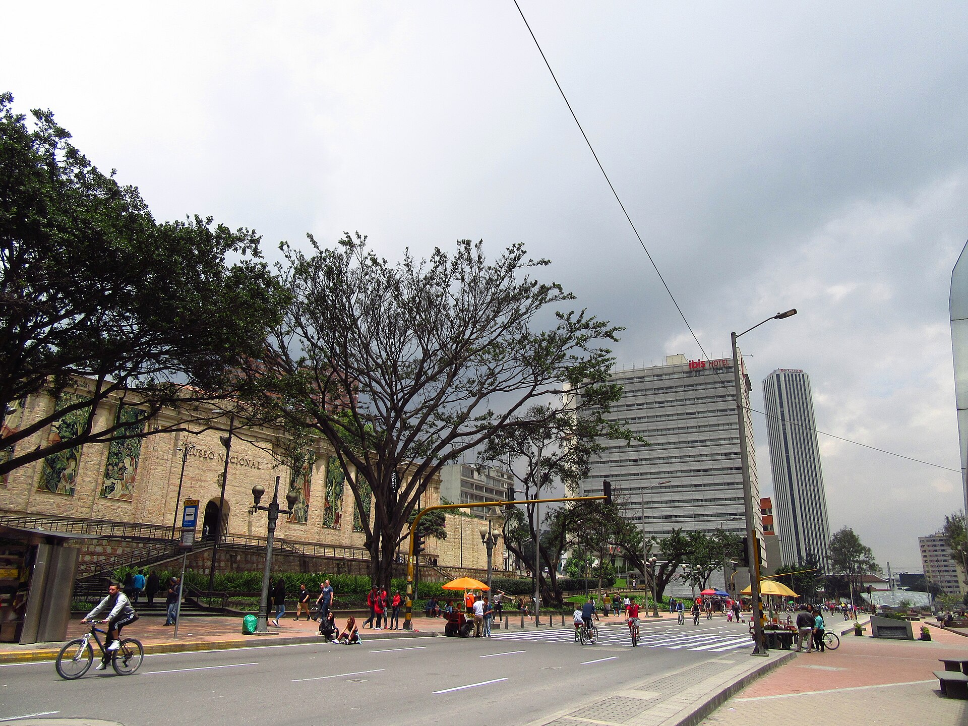 Cyclists on Bogota Ciclovia on Carrera Septima in front of the Museo Nacional