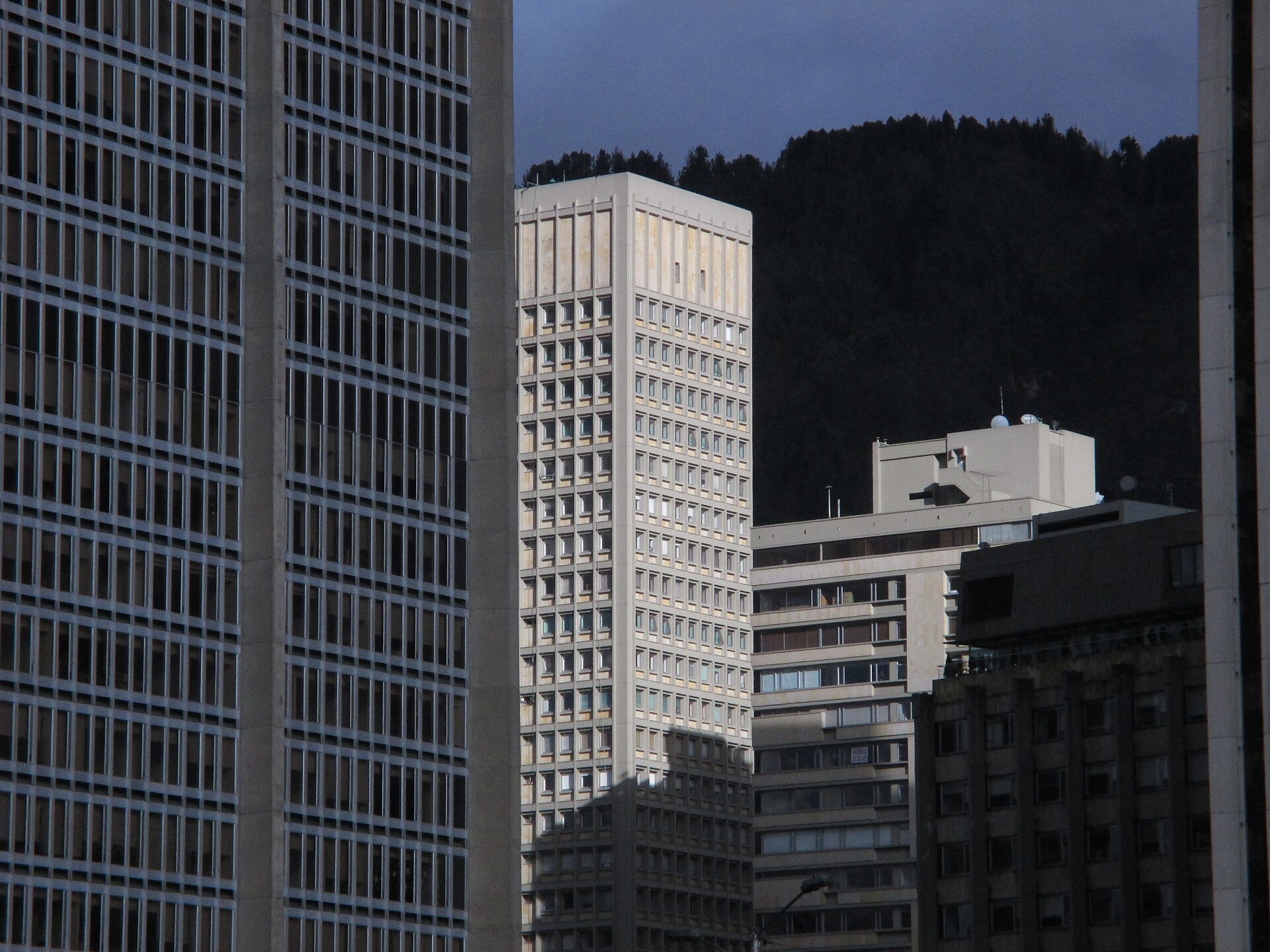 Office towers in the Centro Internacional district of Bogotá, Colombia, with a forested hill behind