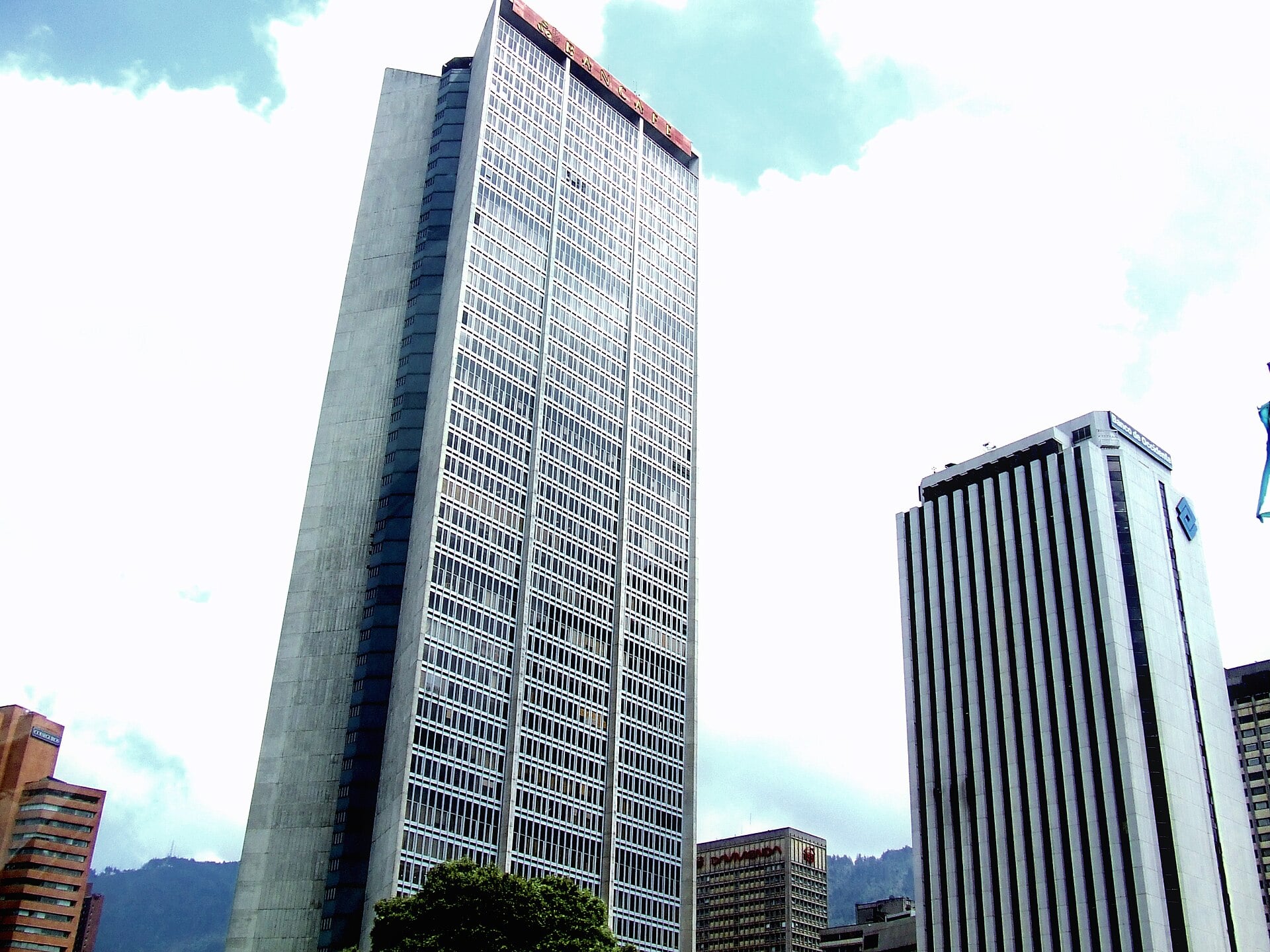 A tall bank office tower beside the Banco de Occidente building in central Bogotá, Colombia