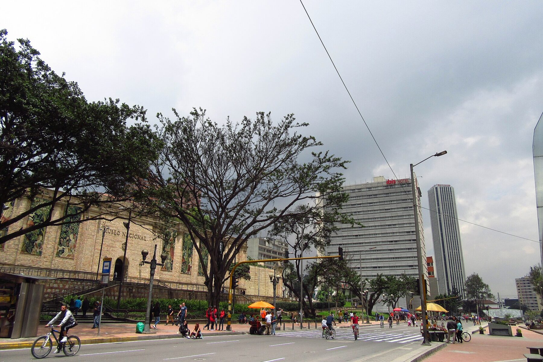 The Museo Nacional de Colombia building and its entrance stairs beside a busy avenue in Bogotá, Colombia