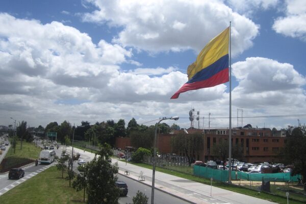 Colombia media: the flag of Colombia beside the state broadcaster RTVC in Bogotá