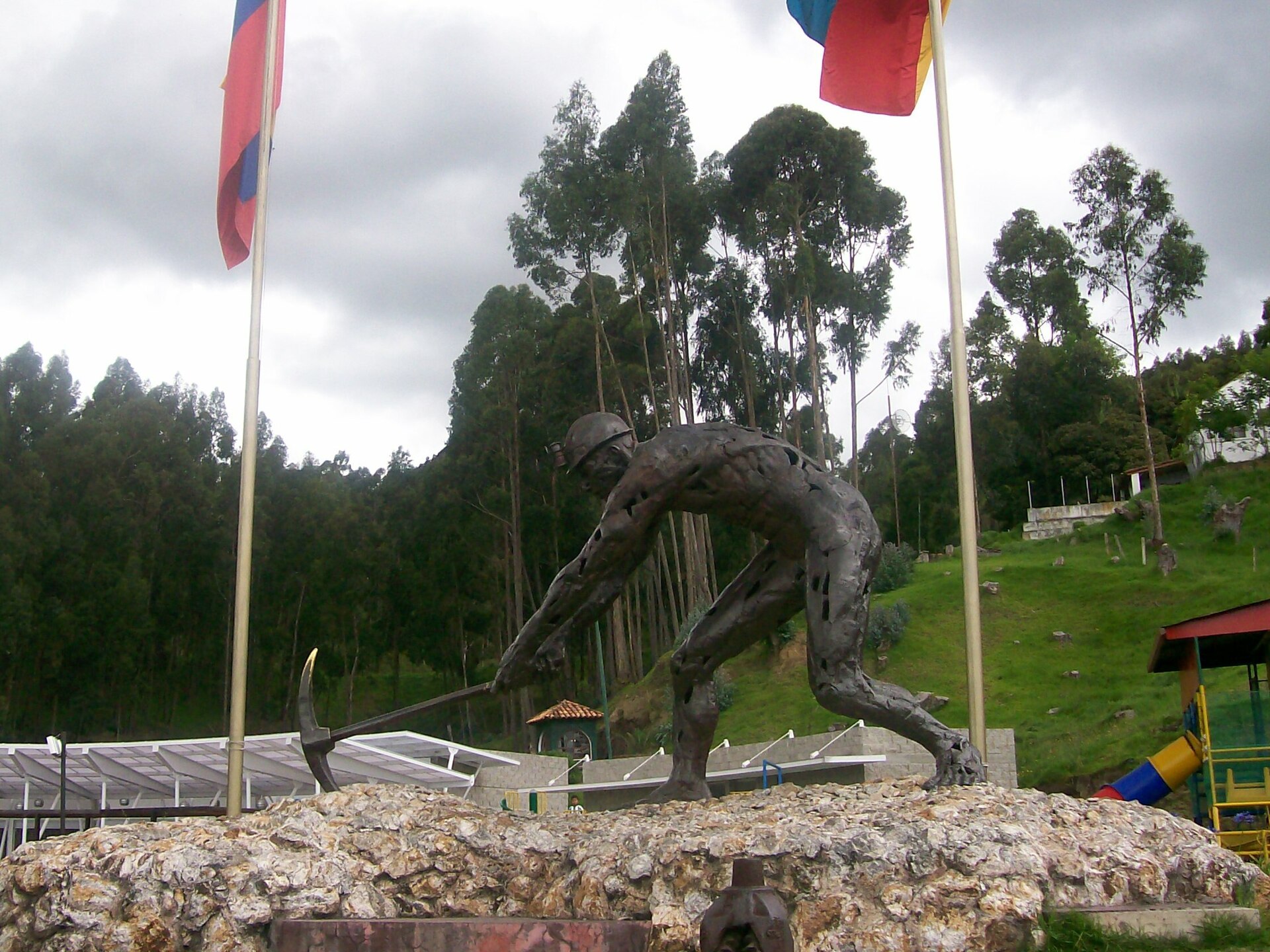 Monument to the Miner, a bronze statue of a miner with a pickaxe, in Zipaquir&aacute;, Colombia