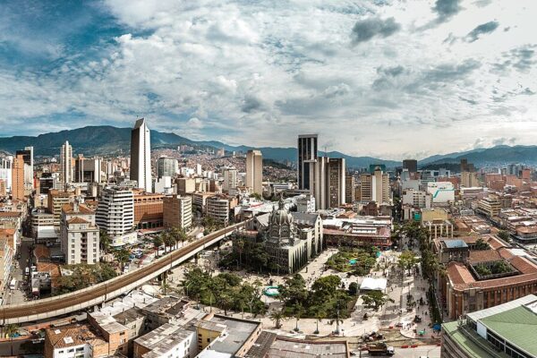 Panoramic view of central Medellin, Colombia, with towers, the cathedral square and mountains behind
