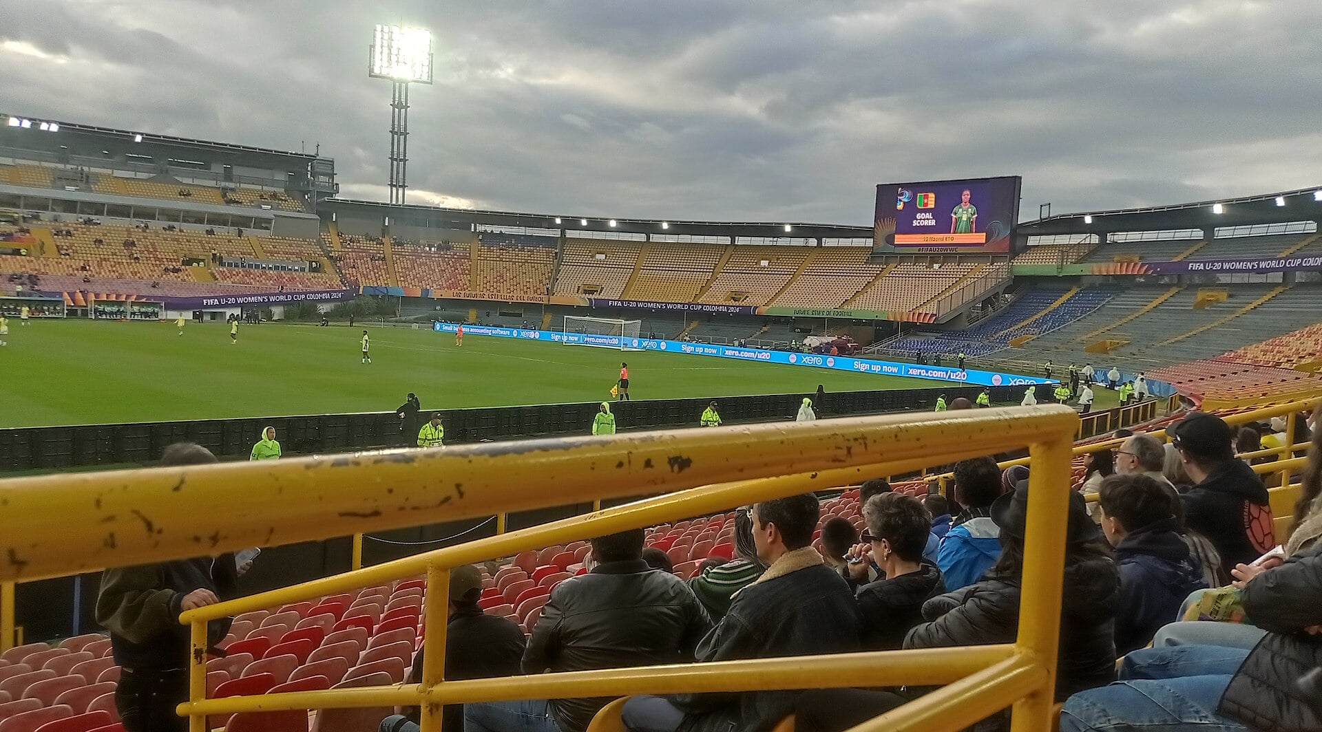 Stands and pitch of Estadio El Campín in Bogotá, Colombia, under floodlights during a 2024 match