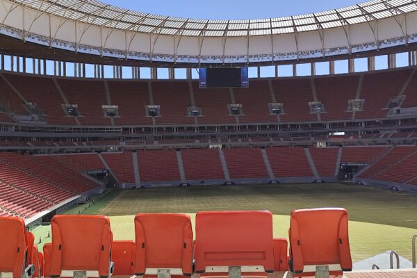 Empty red seats and the roof of the Mané Garrincha stadium in Brasília, venue of the 2026 Copa do Brasil final