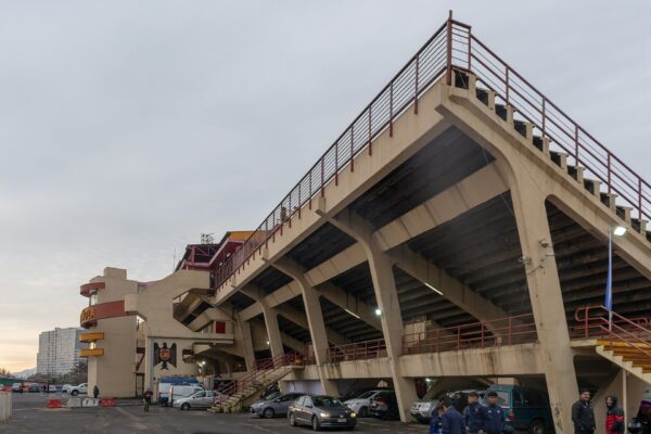 Concrete grandstand and club emblem outside Estadio Santa Laura in Independencia, Santiago, Chile