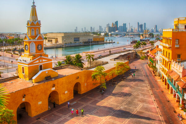 Clock Tower Gate and the old city of Cartagena, Colombia, with the modern skyline across the bay