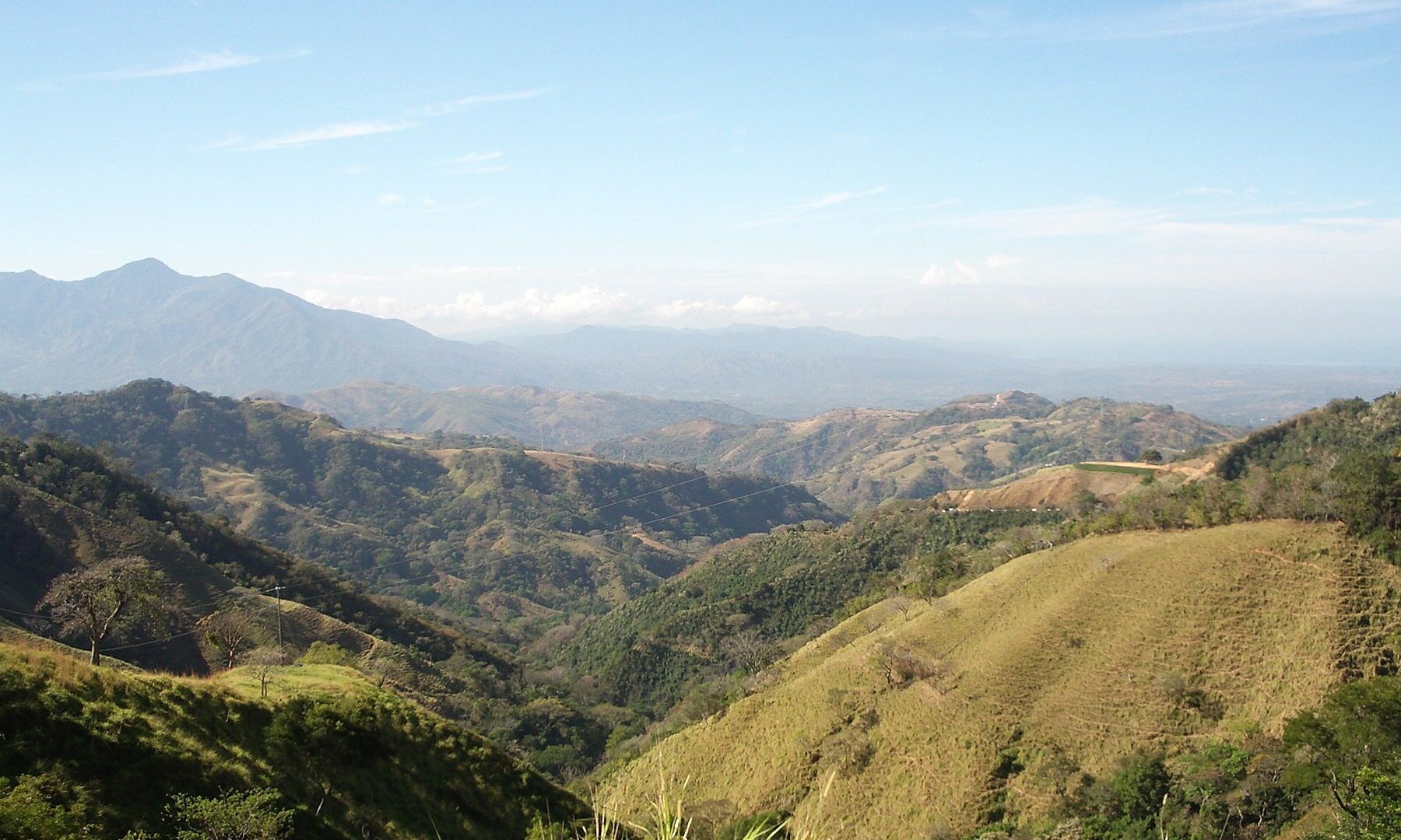 Green hills and farmland in the countryside around Esparza in Puntarenas province, Costa Rica