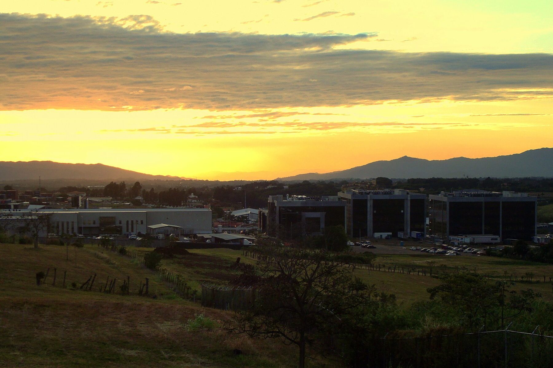Office and factory buildings of the Zona Franca América free zone in Heredia, Costa Rica, at sunset