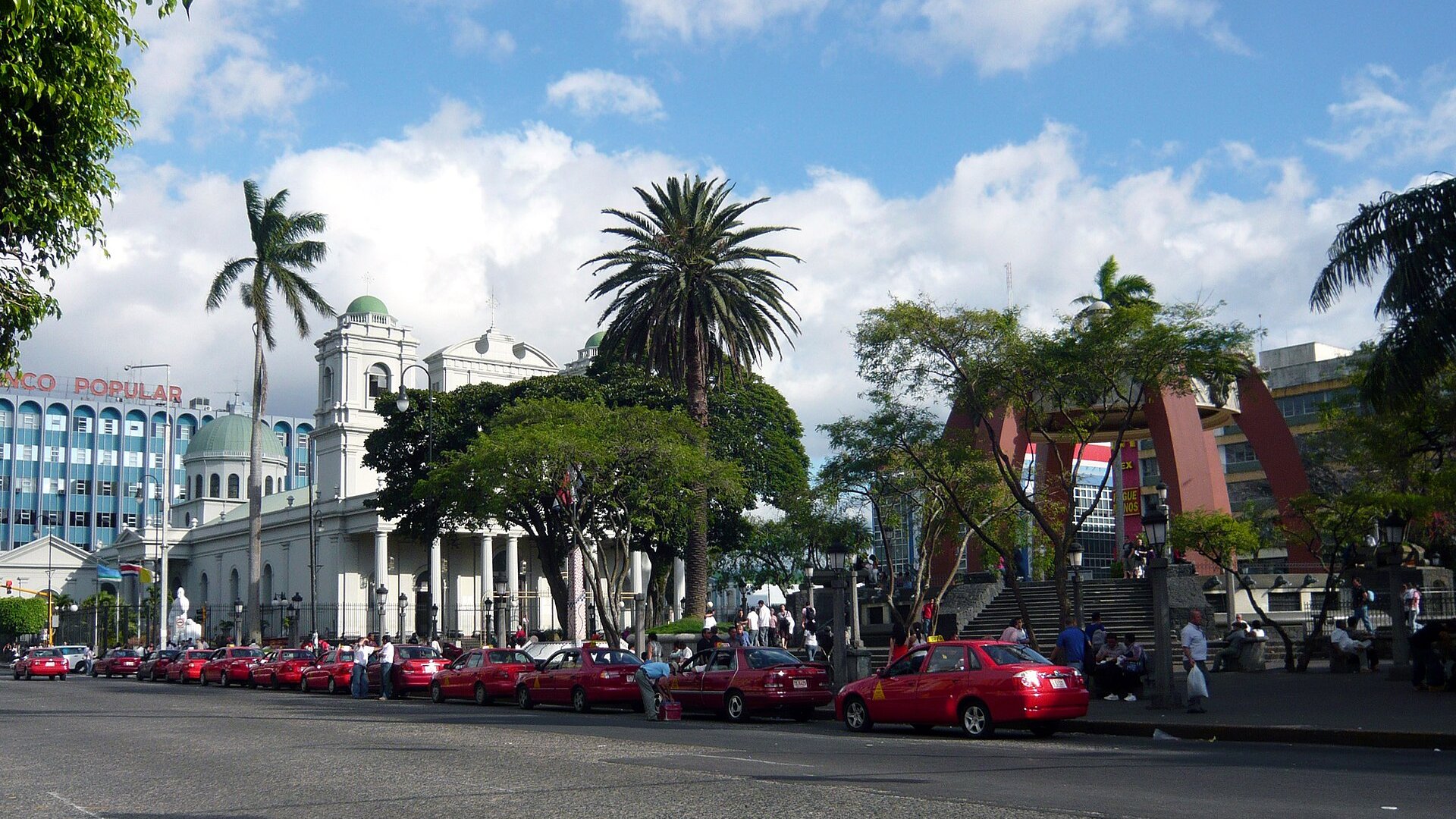Red taxis lined up beside the Metropolitan Cathedral on Avenida 2 in central San José, Costa Rica