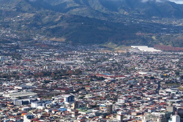 Aerial view of downtown San José, Costa Rica's capital, with the Central Valley mountains behind it.