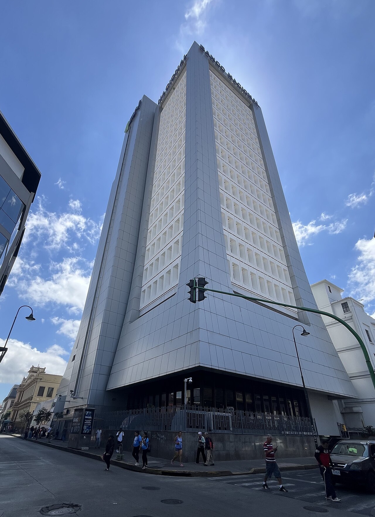 The tall tower of Banco Nacional de Costa Rica seen from the street corner in downtown San José.