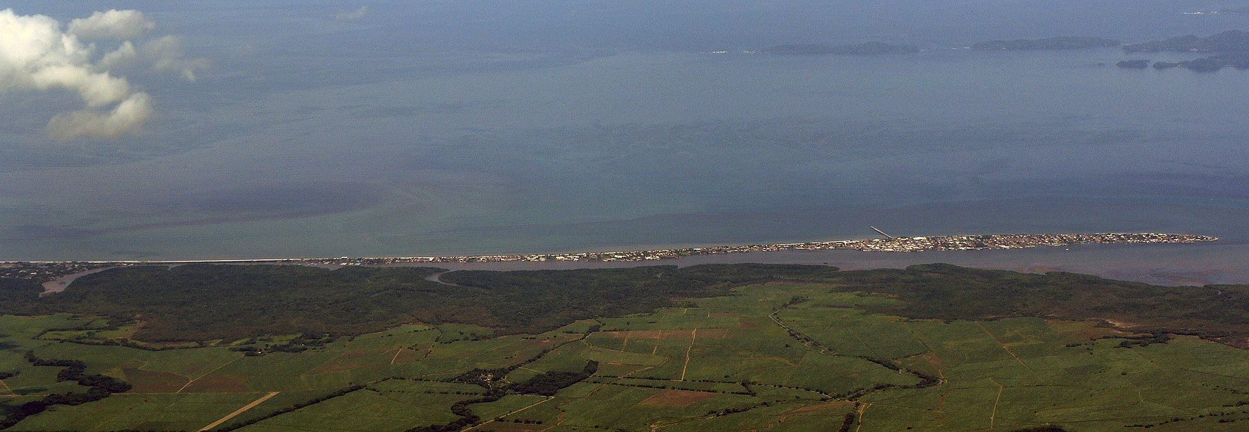 Aerial view of the Puntarenas peninsula and the Gulf of Nicoya on Costa Rica's Pacific coast, with farmland in the foreground