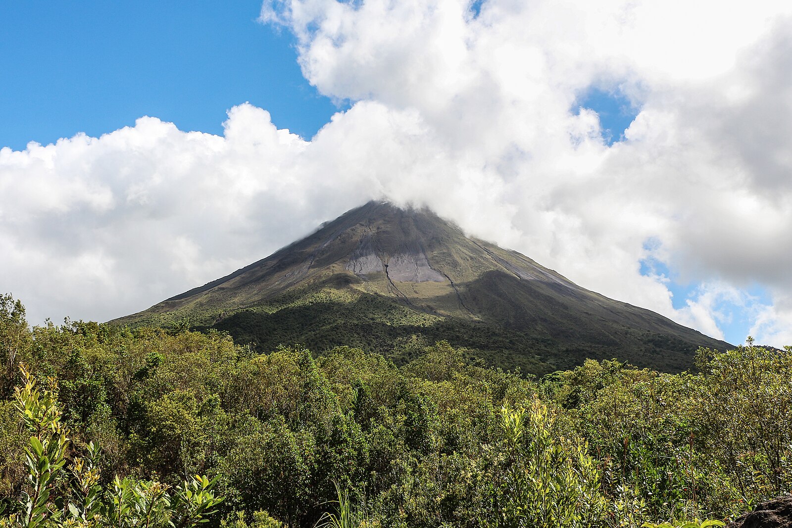 Arenal Volcano above rainforest near La Fortuna, a fixture of Costa Rica travel costs planning