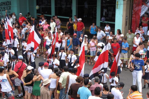 Students with Costa Rican flags in a 15 September school band parade, Costa Rican independence day