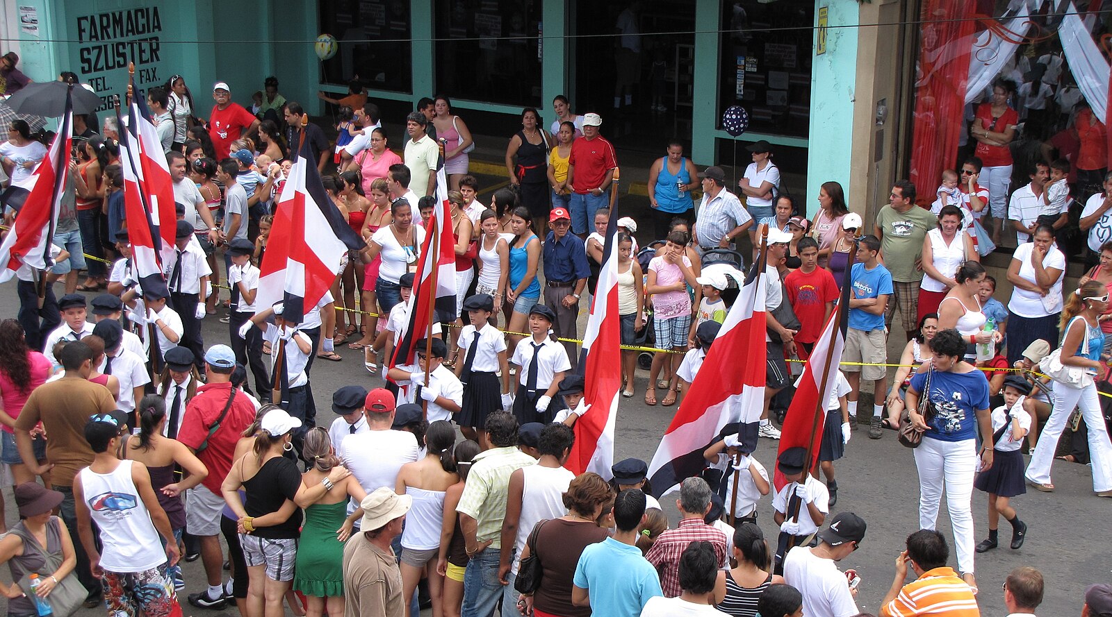Students with Costa Rican flags in a 15 September school band parade, Costa Rican independence day