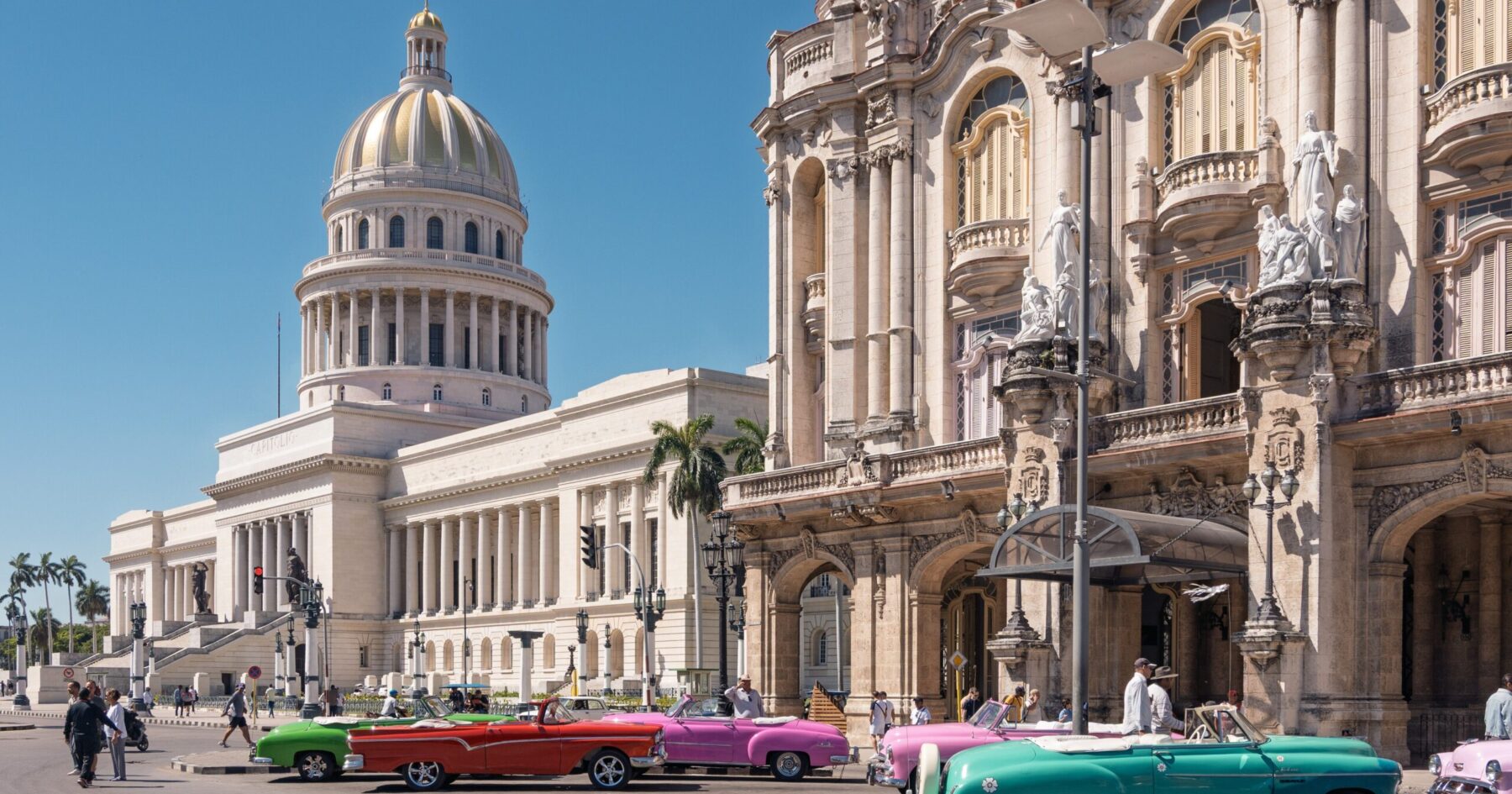 The National Capitol and the Great Theatre of Havana with classic cars parked in front