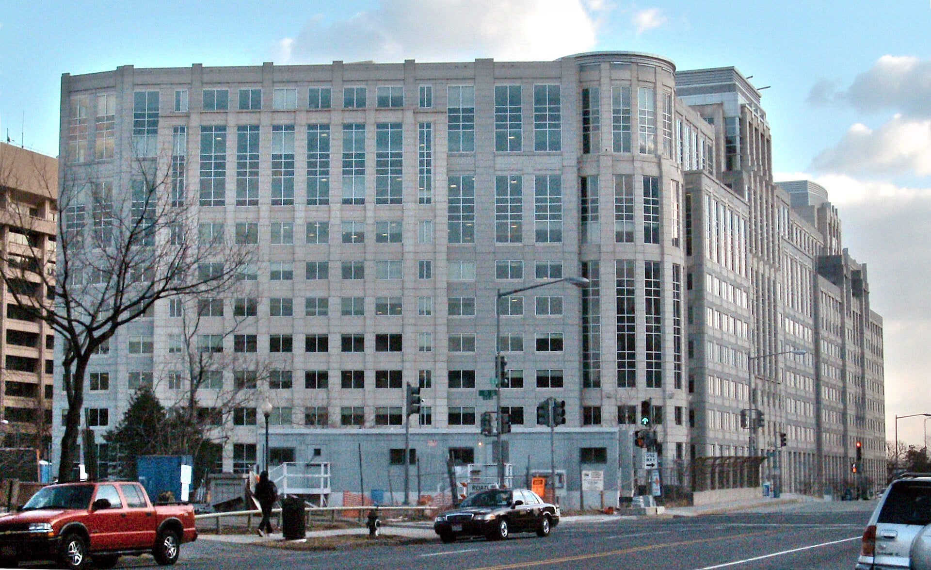 ICE headquarters, a large stone-colored office building on a Washington street corner