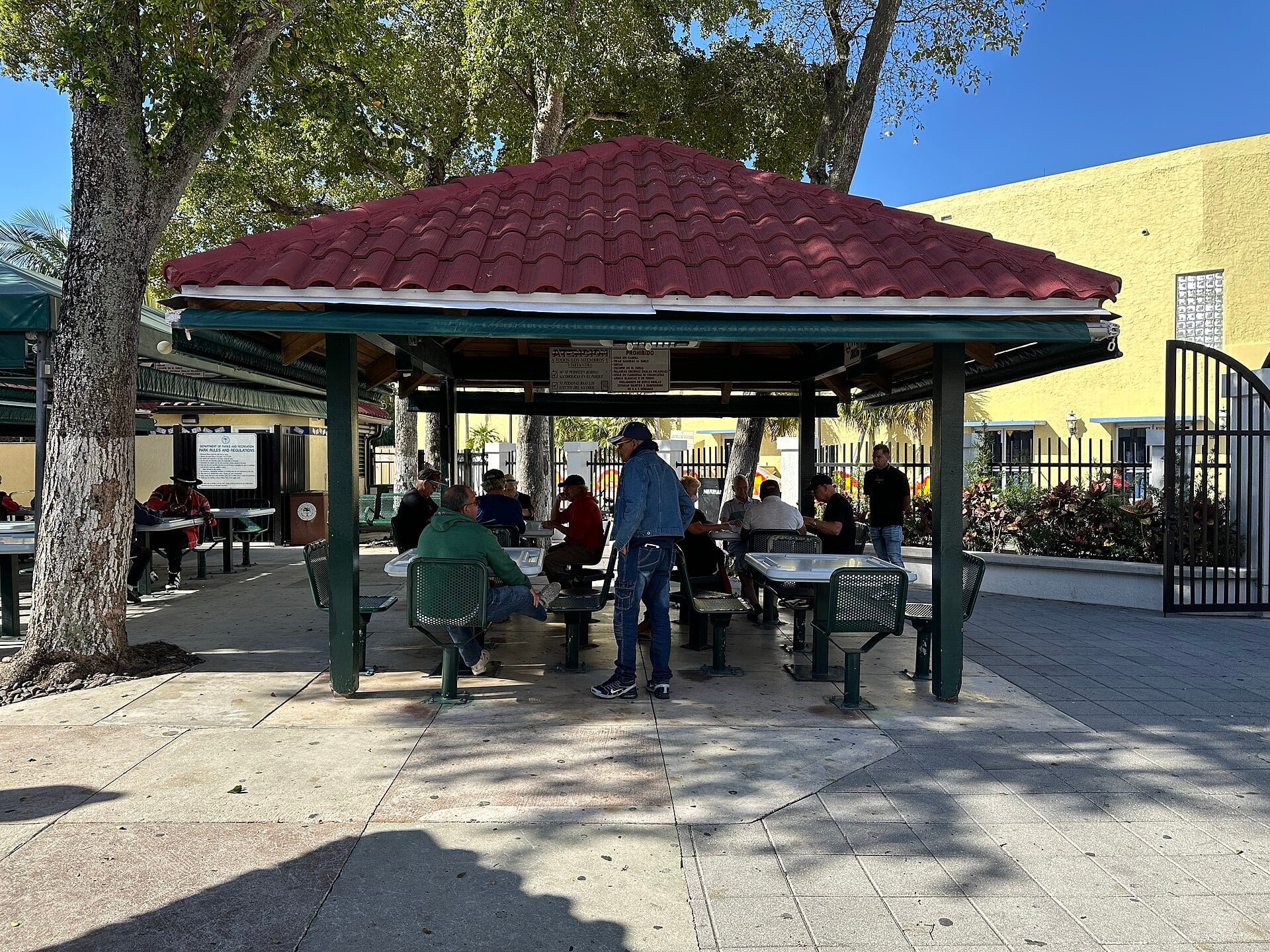 Domino Park in Little Havana, Miami, with players at tables