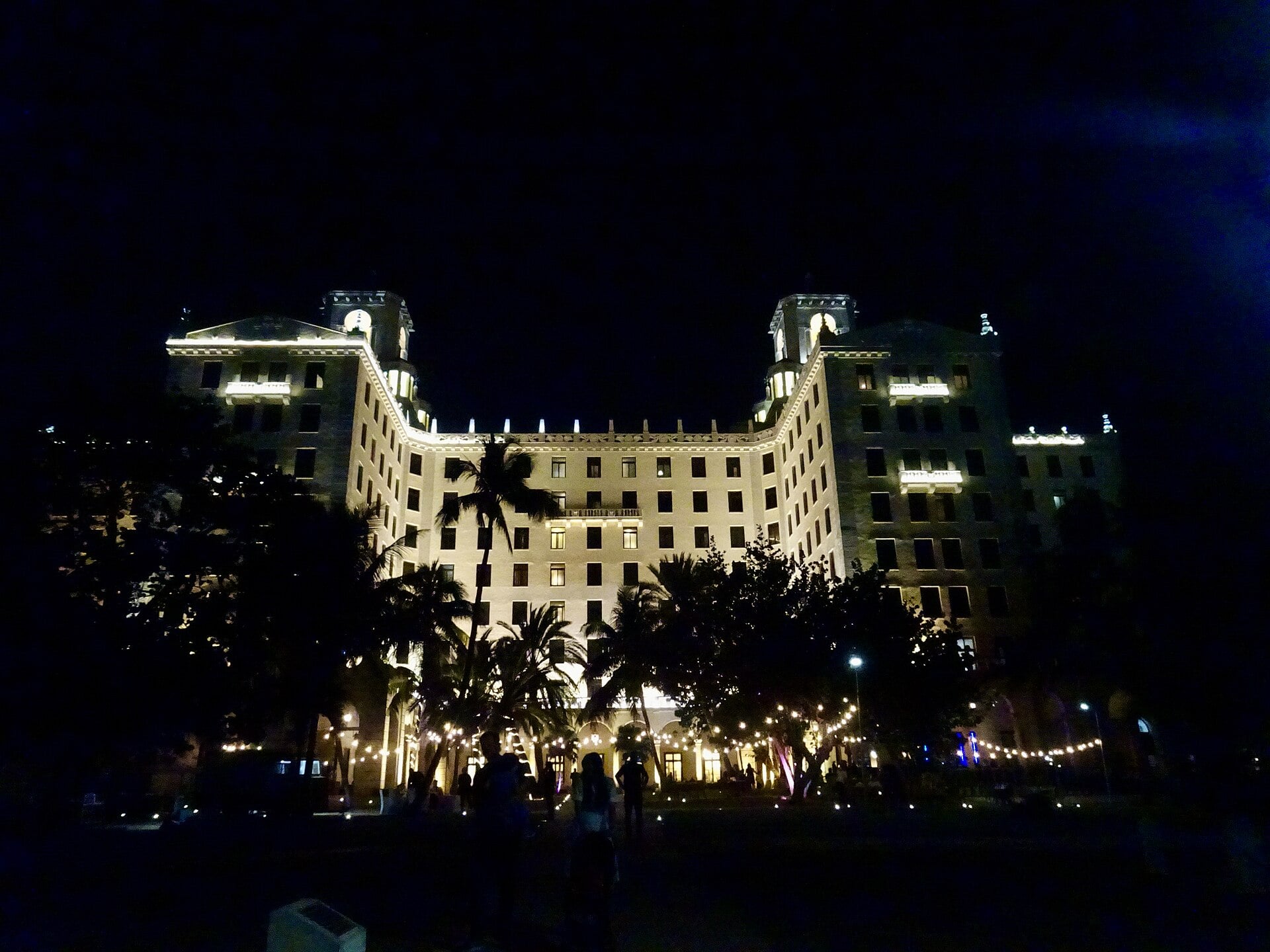 A large building lit up at night in Havana, Cuba