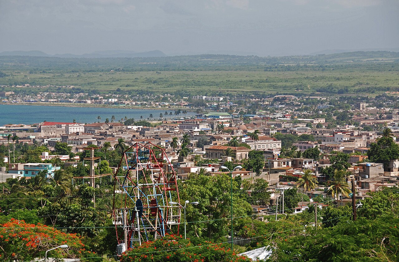 Rooftops of Matanzas, Cuba, and its bay seen from the hill of the Monserrate hermitage, with the frame of an old Ferris wheel in the foreground
