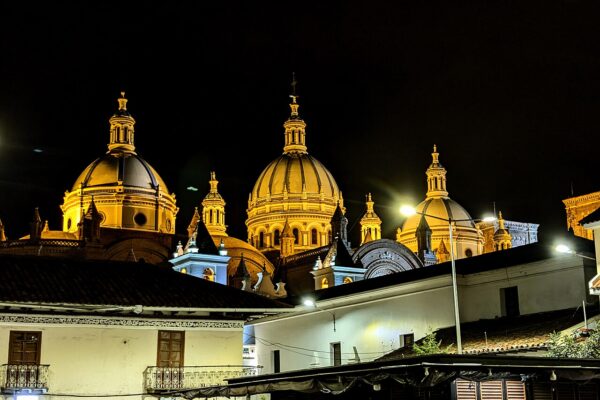Illuminated domes of the New Cathedral in Cuenca, Ecuador, at night