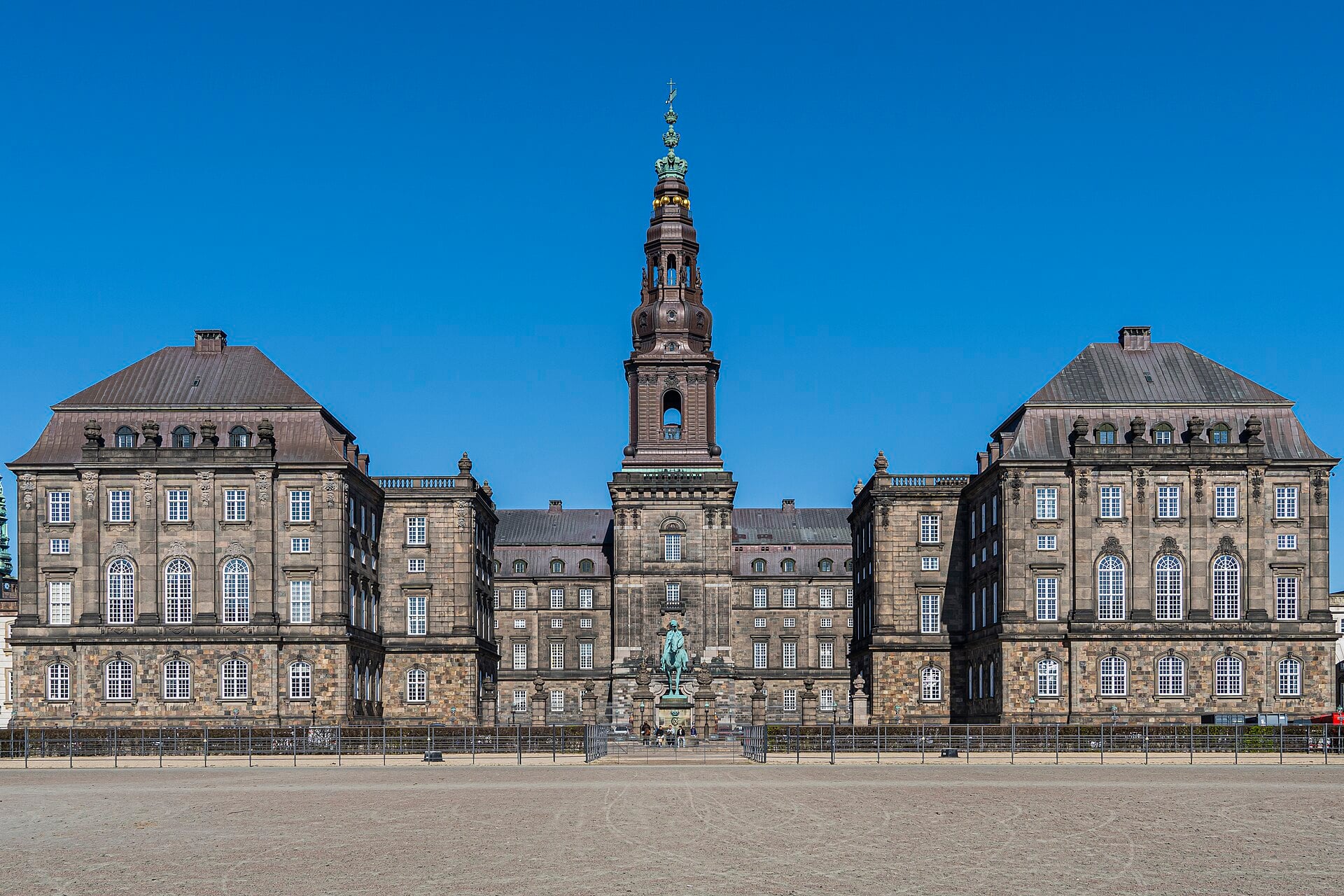 Christiansborg Palace in Copenhagen, home of the Danish parliament, with its tall tower under a blue sky