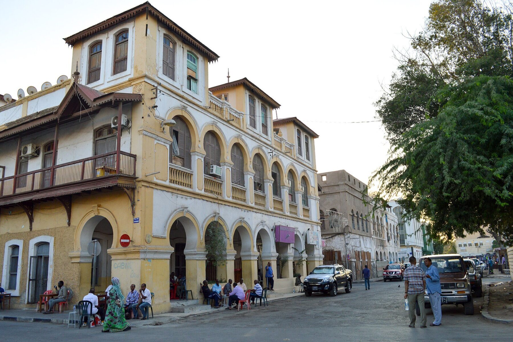 A colonial-era arcaded building and street cafe at Place Menelik in central Djibouti City