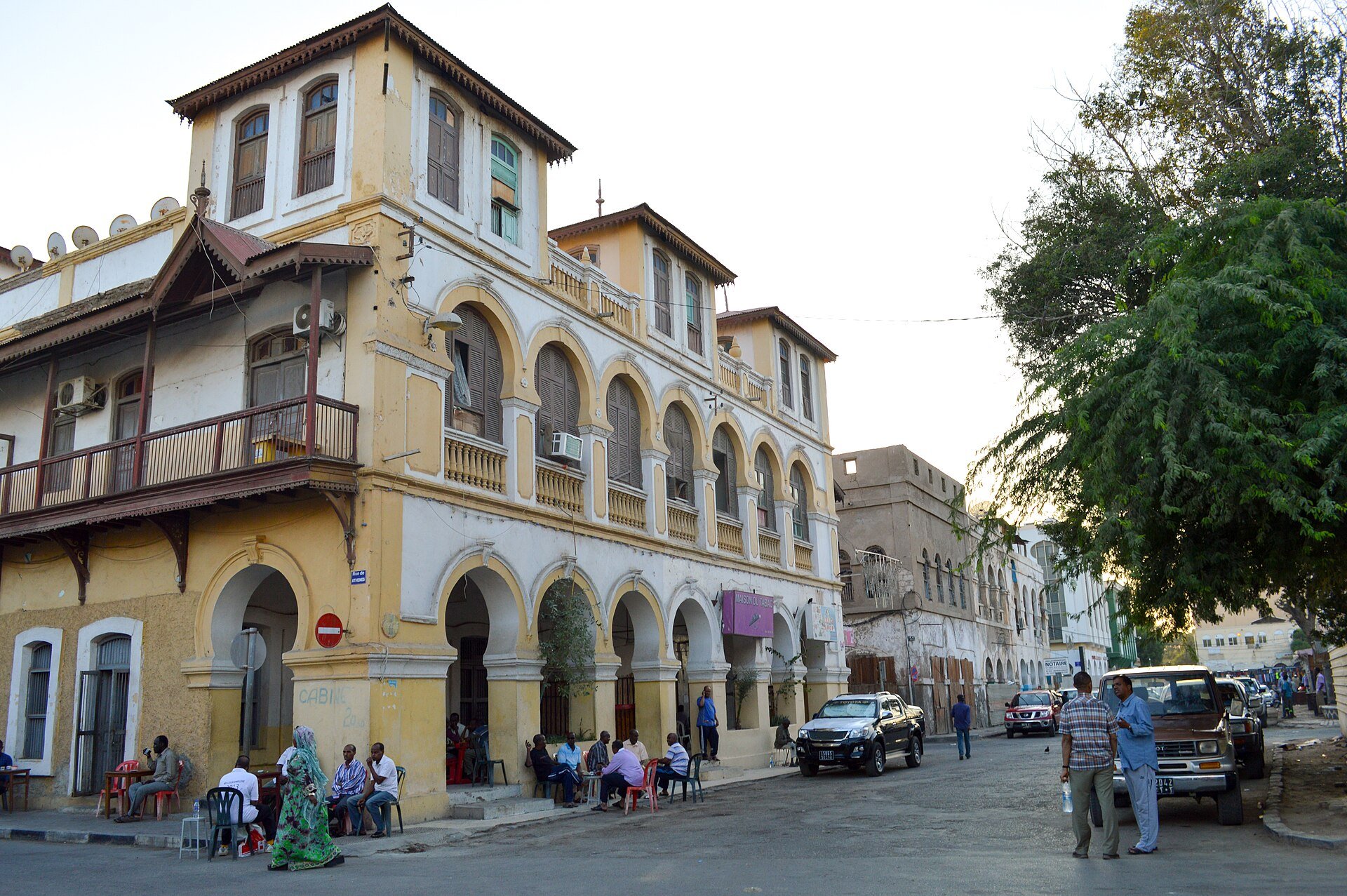 A colonial-era arcaded building and street cafe at Place Menelik in central Djibouti City