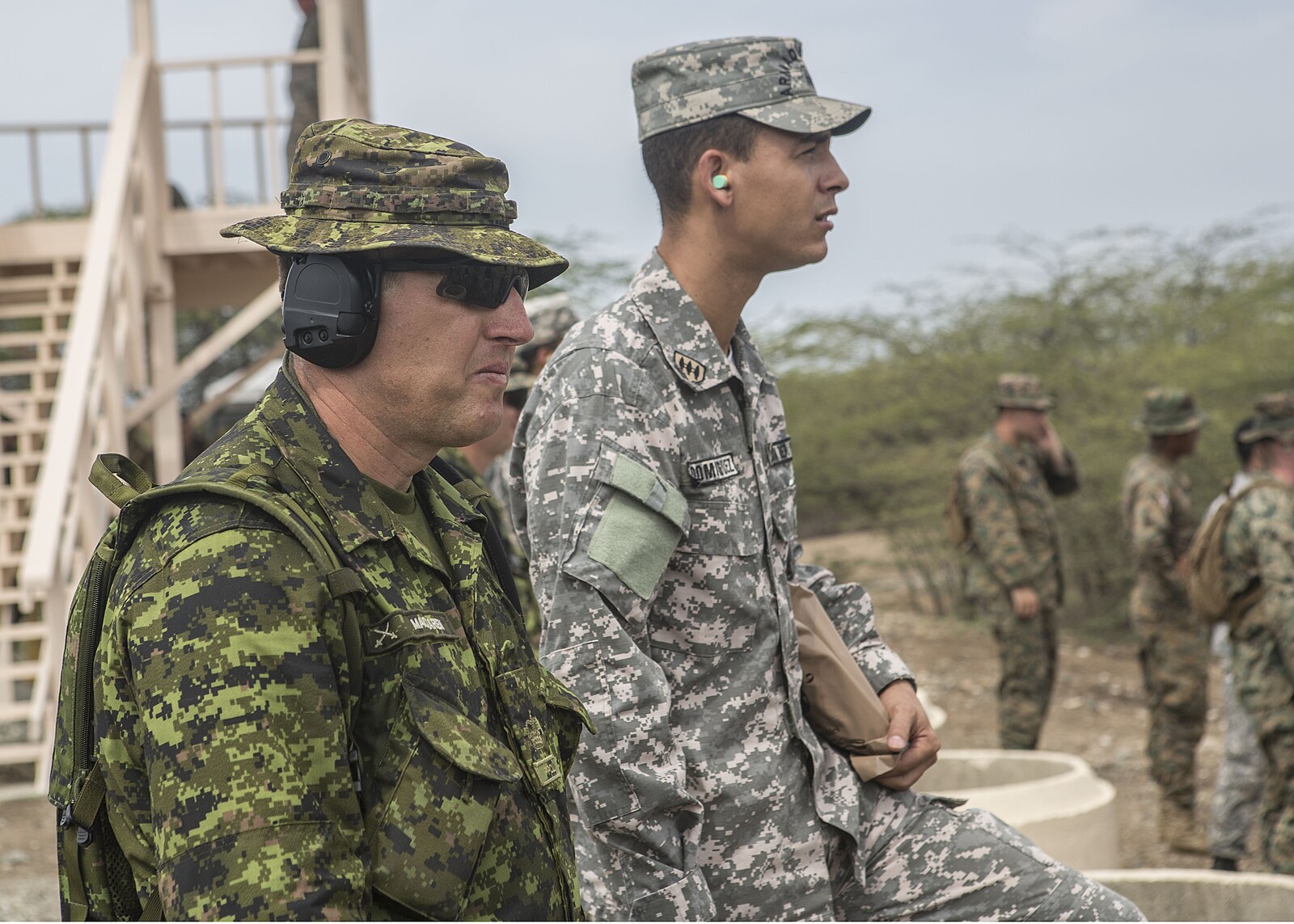 A Dominican Republic Army officer and a Canadian Army officer at a rifle range during the Tradewinds 2014 exercise near Baní, Dominican Republic