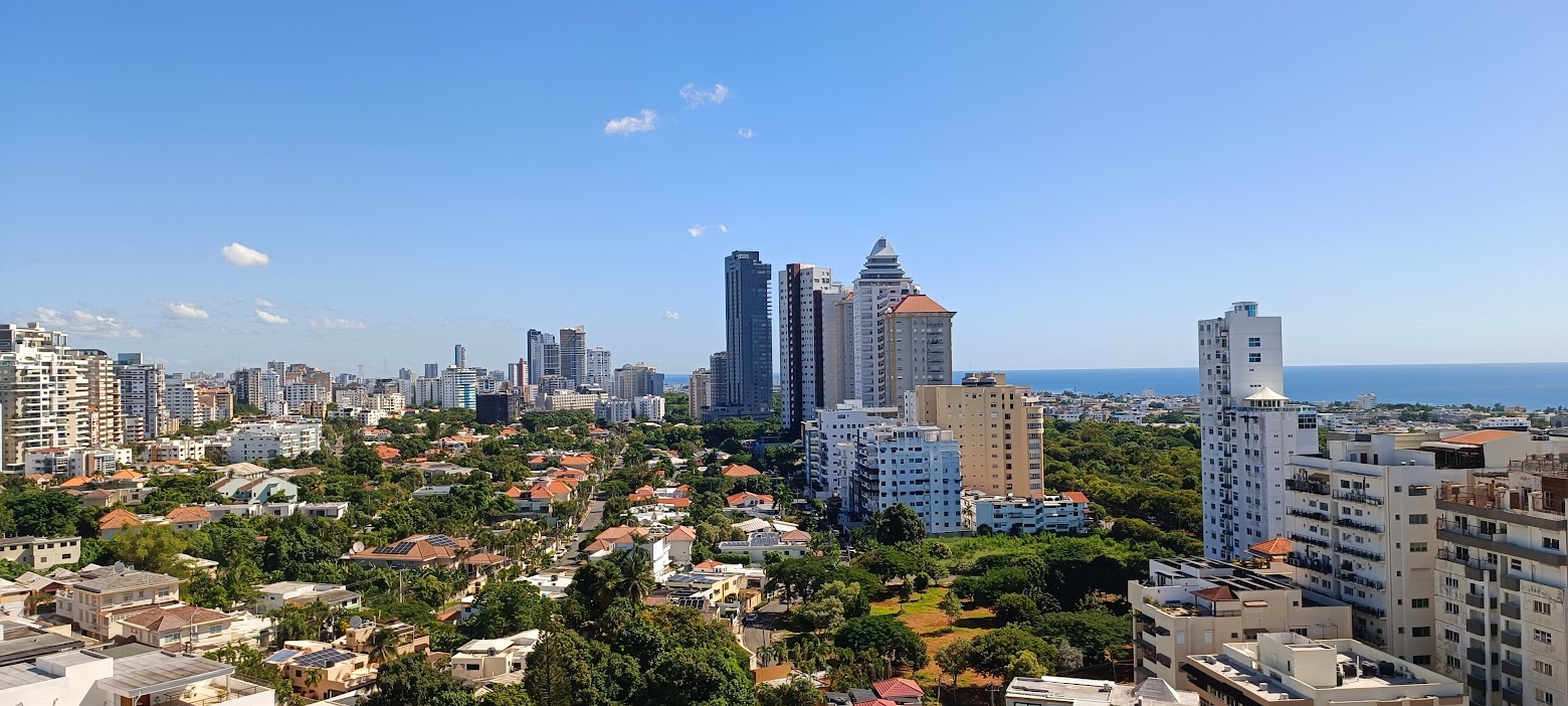 Apartment towers, villas and the Caribbean horizon in the Los Cacicazgos area of Santo Domingo, Dominican Republic
