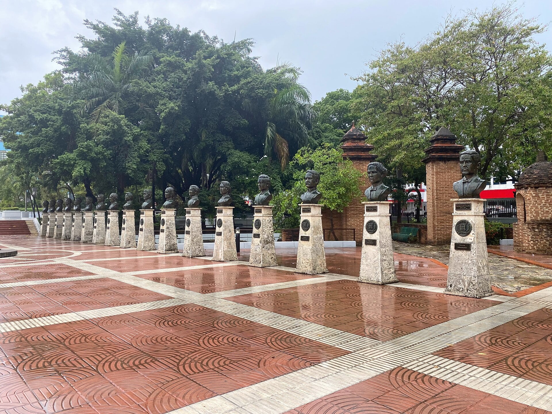 A row of bronze busts on stone pedestals in Parque Independencia, Santo Domingo