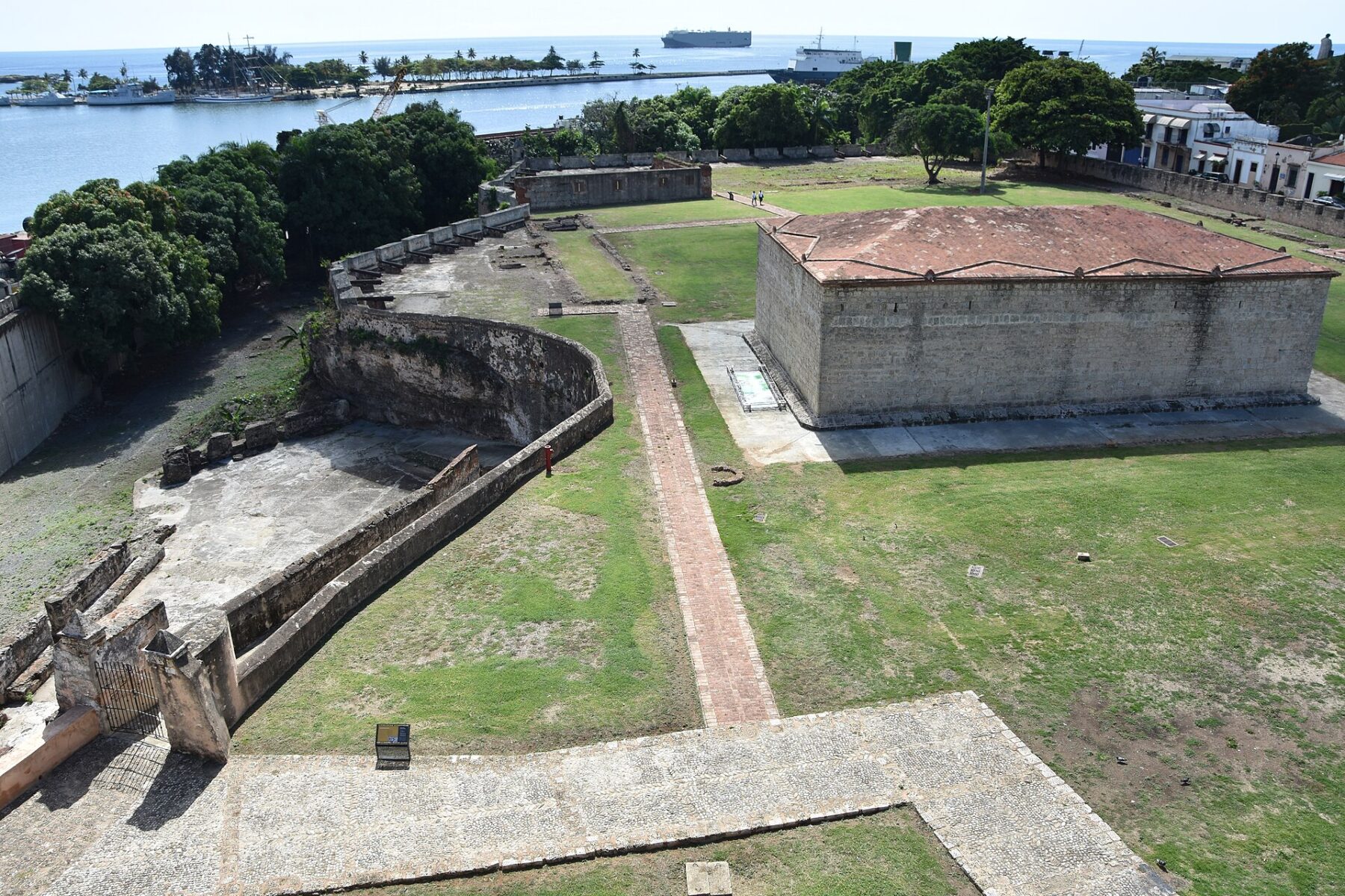 Stone walls and a roofed bastion of the Fortaleza Ozama beside the harbour in Santo Domingo, Dominican Republic
