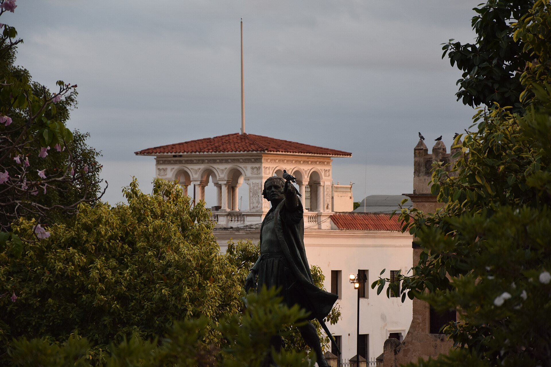 Statue of Christopher Columbus in Parque Colón, Santo Domingo, at dusk