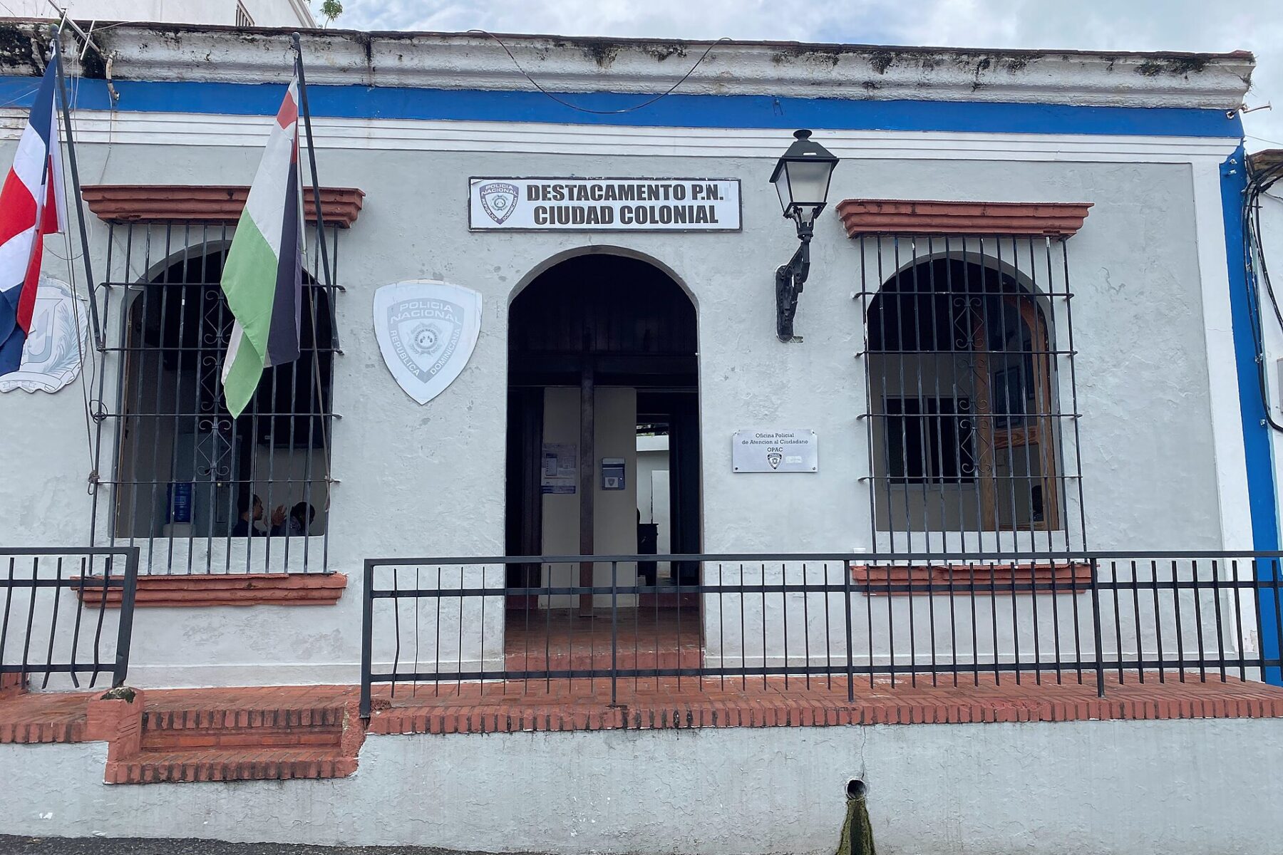 A Policía Nacional post with flags and a shield on its facade in the colonial zone of Santo Domingo