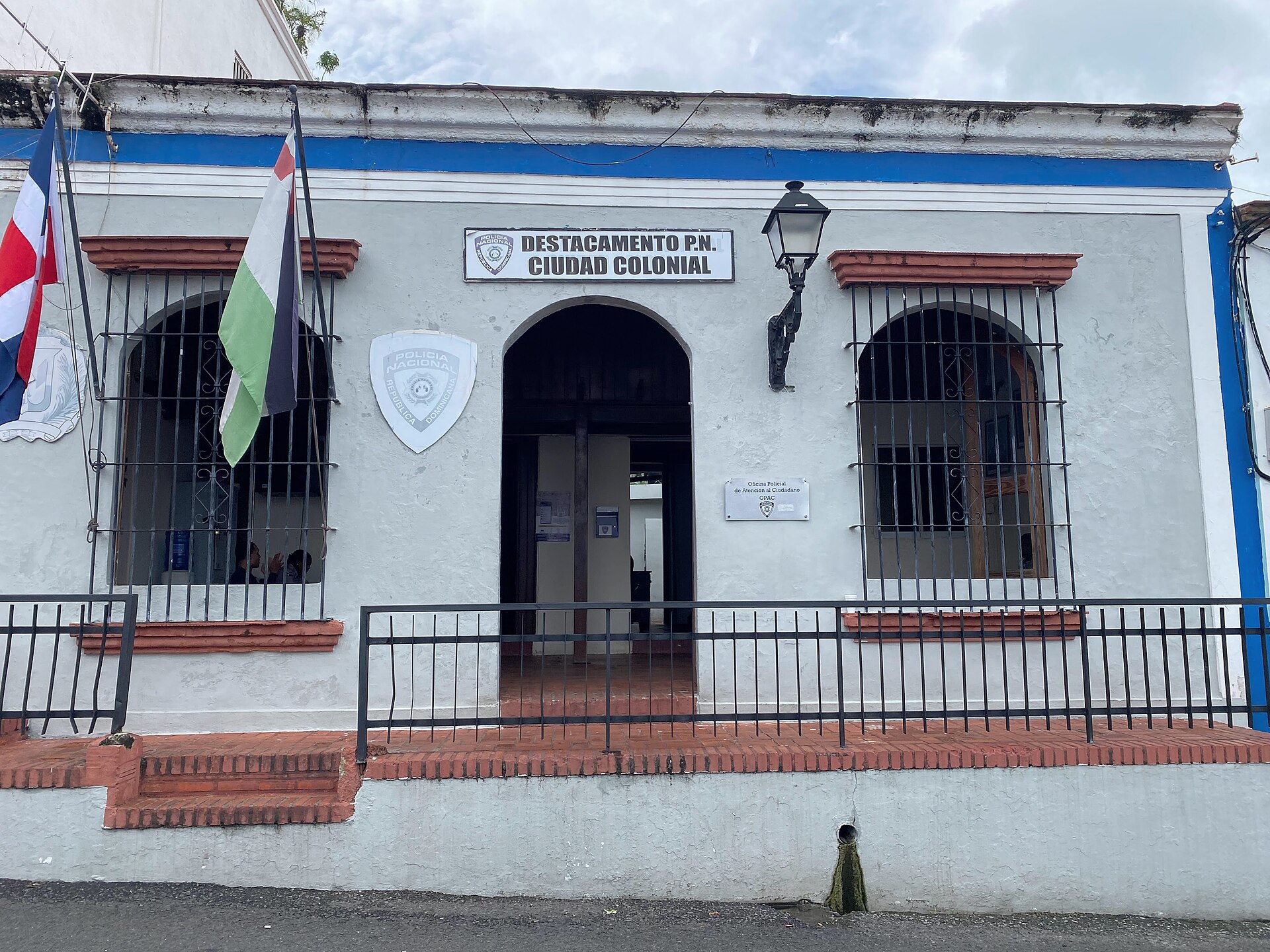 A Policía Nacional post with flags and a shield on its facade in the colonial zone of Santo Domingo