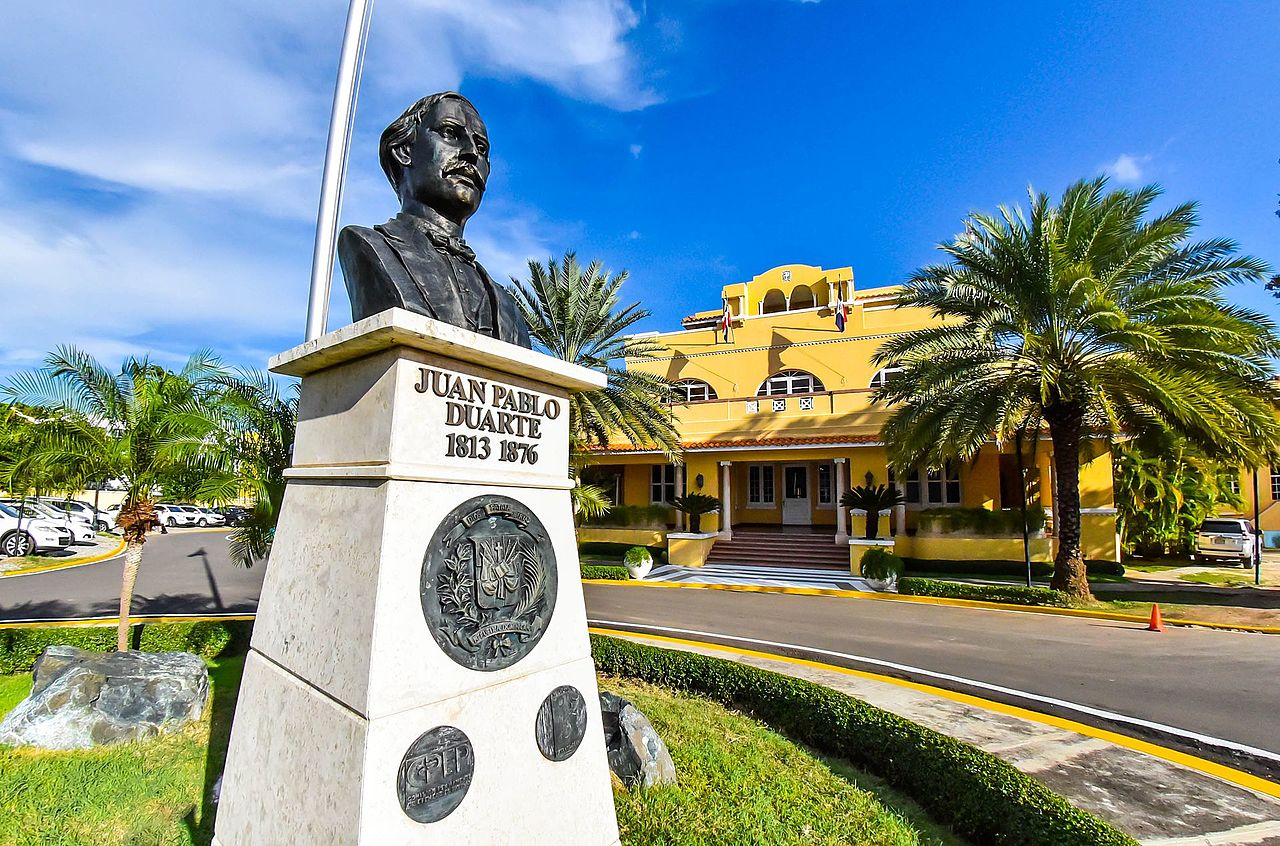 Bust of Juan Pablo Duarte in front of the yellow Estancia San Gerónimo building of the Dominican foreign ministry in Santo Domingo