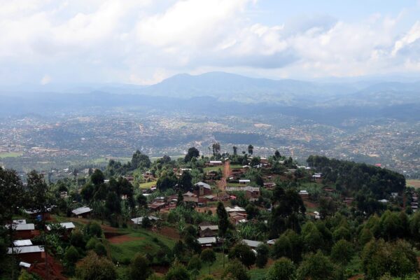 Hillside homes and a valley town in Butembo, North Kivu province, eastern DR Congo, under a cloudy sky