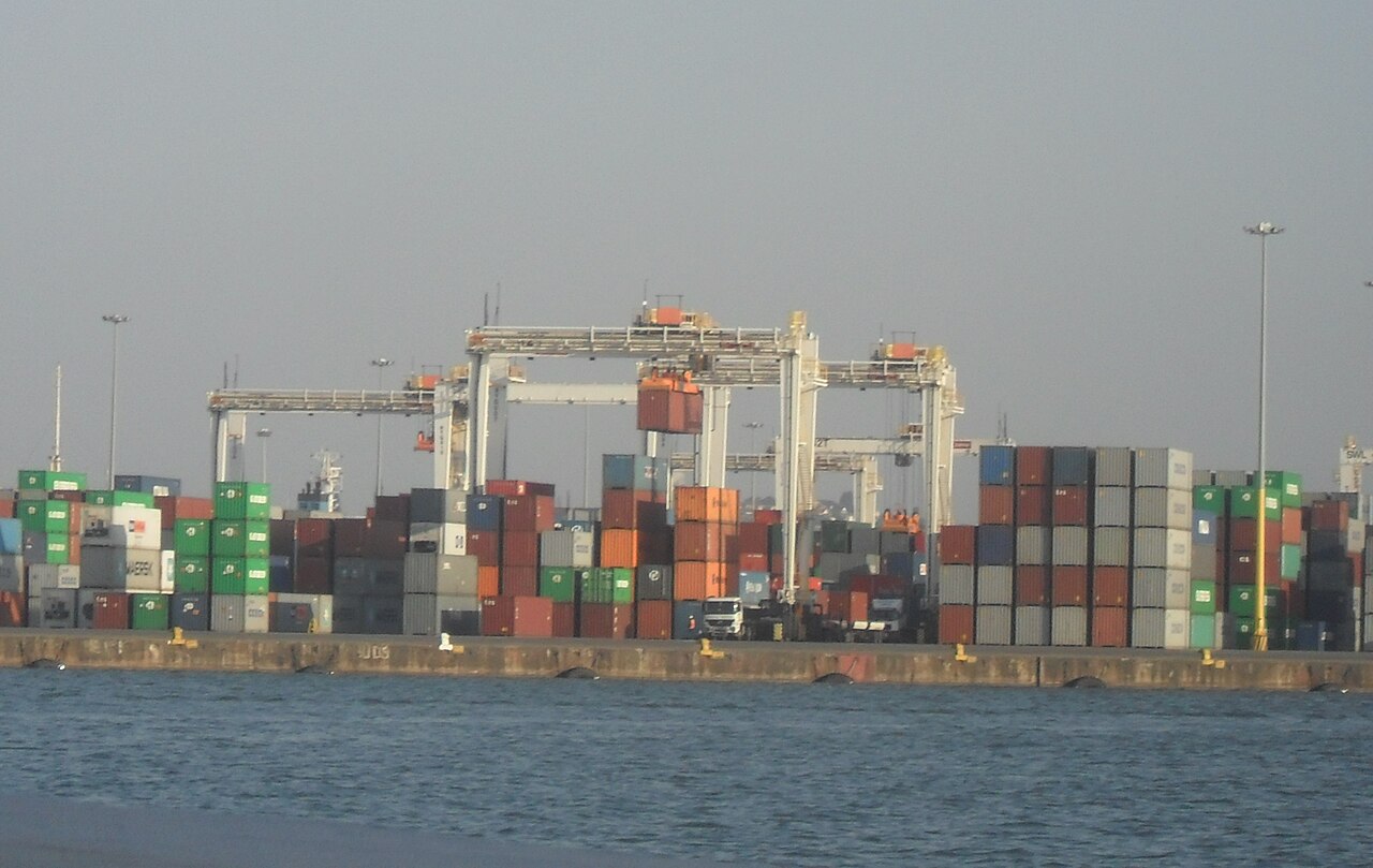 Stacked shipping containers and gantry cranes at the Port of Durban