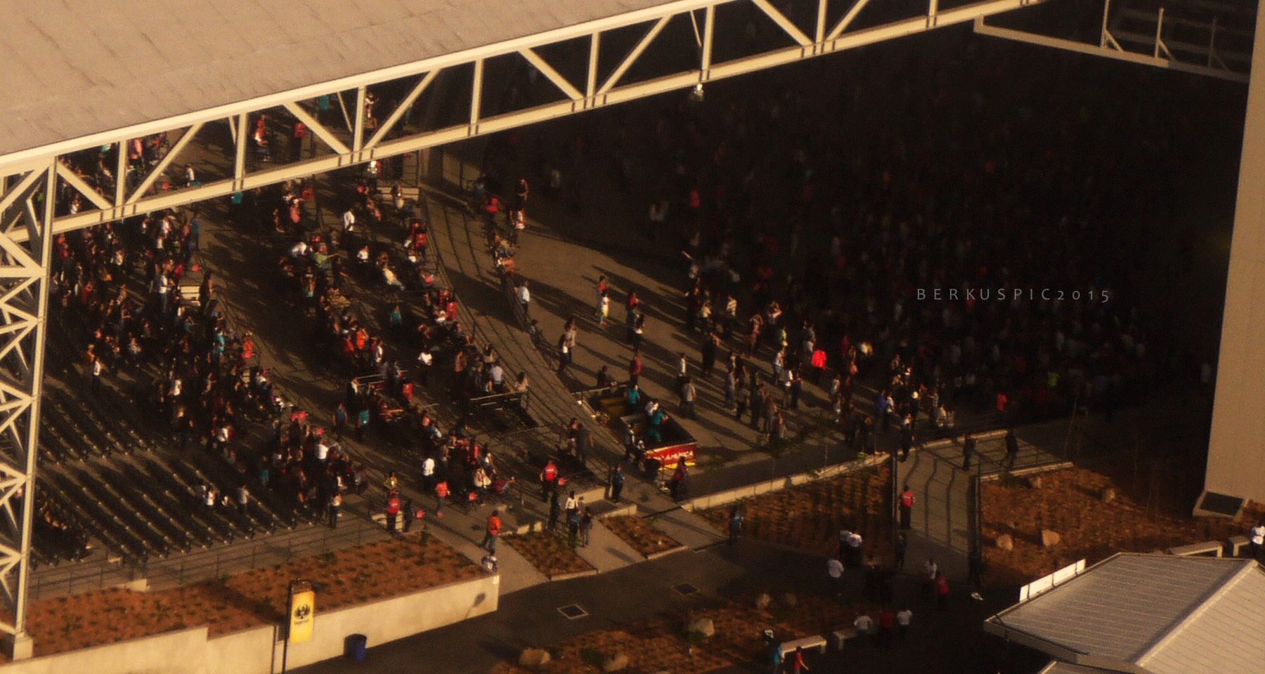 Elevated view of the roofed seating at the Parque Viva amphitheatre in La Guácima, Costa Rica, with concertgoers arriving