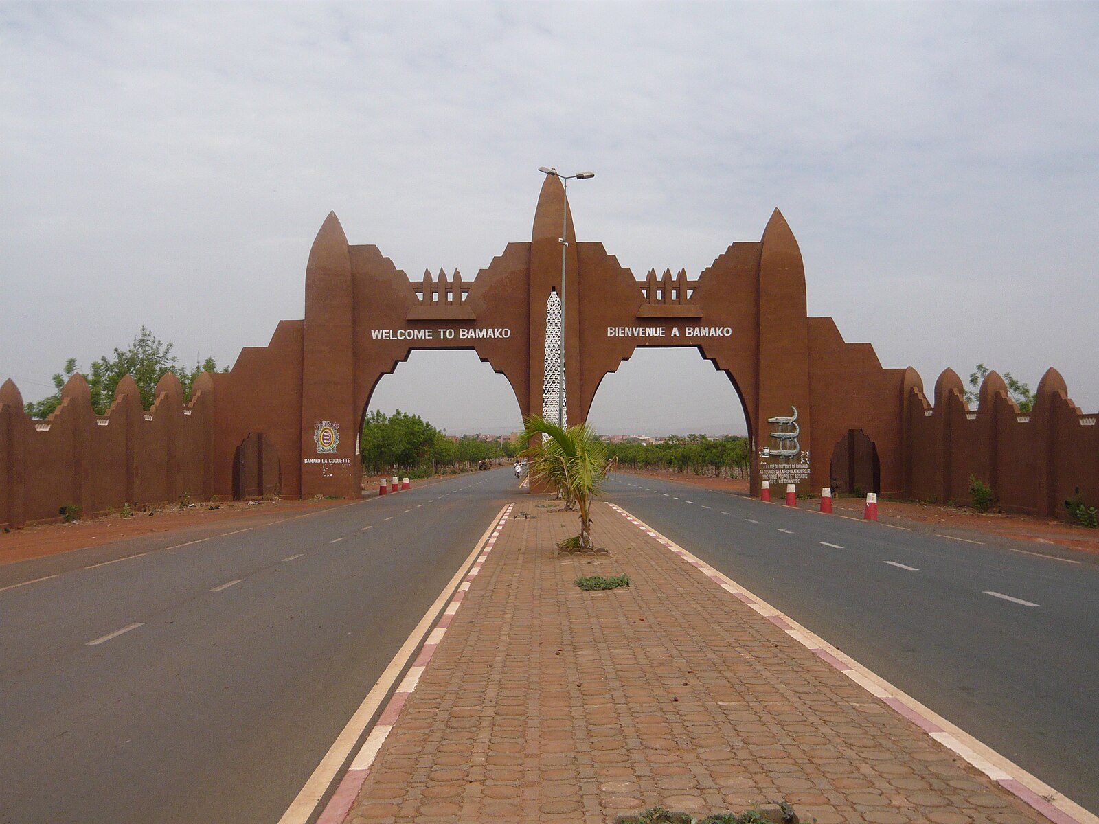 The welcome arch at the entrance to Bamako, Mali, with the road to the airport