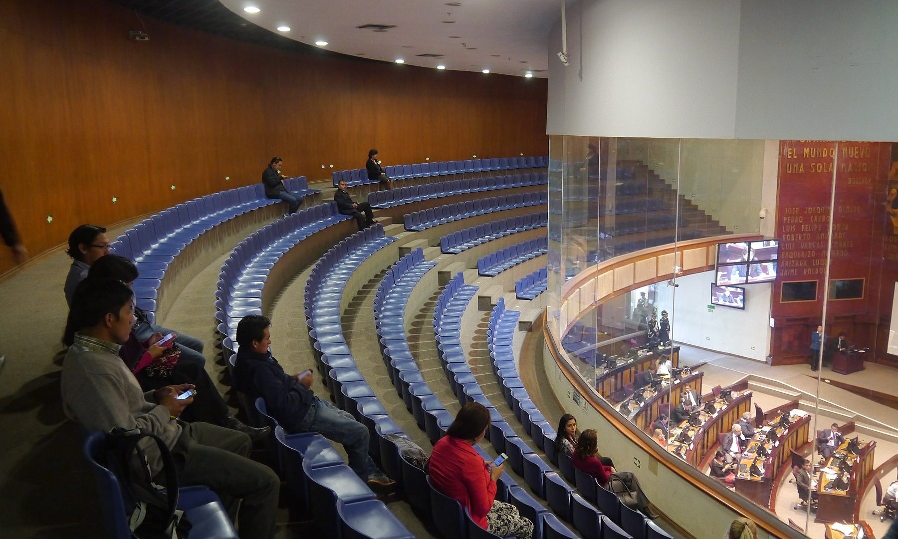 Public gallery above the plenary hall of Ecuador's National Assembly in Quito with legislators at their desks