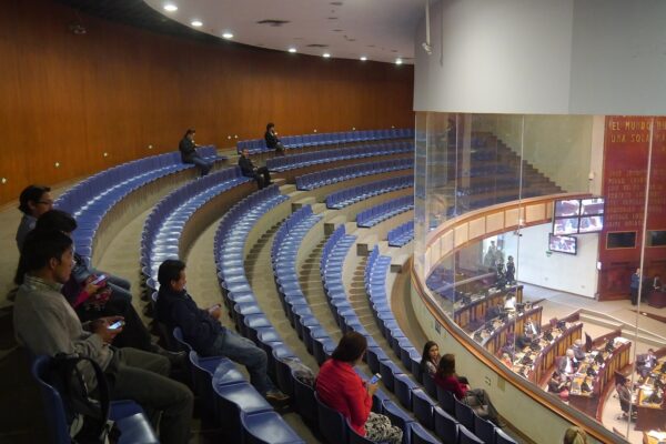 Public gallery above the plenary hall of Ecuador's National Assembly in Quito with legislators at their desks