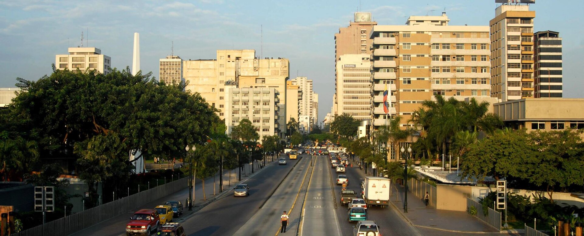 Office towers and traffic on a main avenue in central Guayaquil, Ecuador