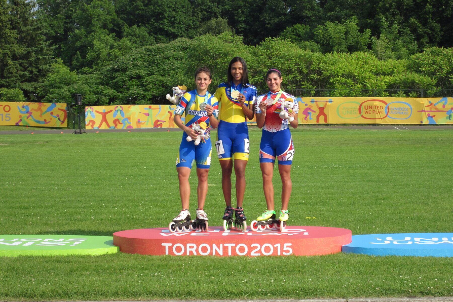 Women's 200 metres time-trial podium at the 2015 Pan American Games in Toronto, with an Ecuadorian skater at left (not identified as Gabriela Vargas)