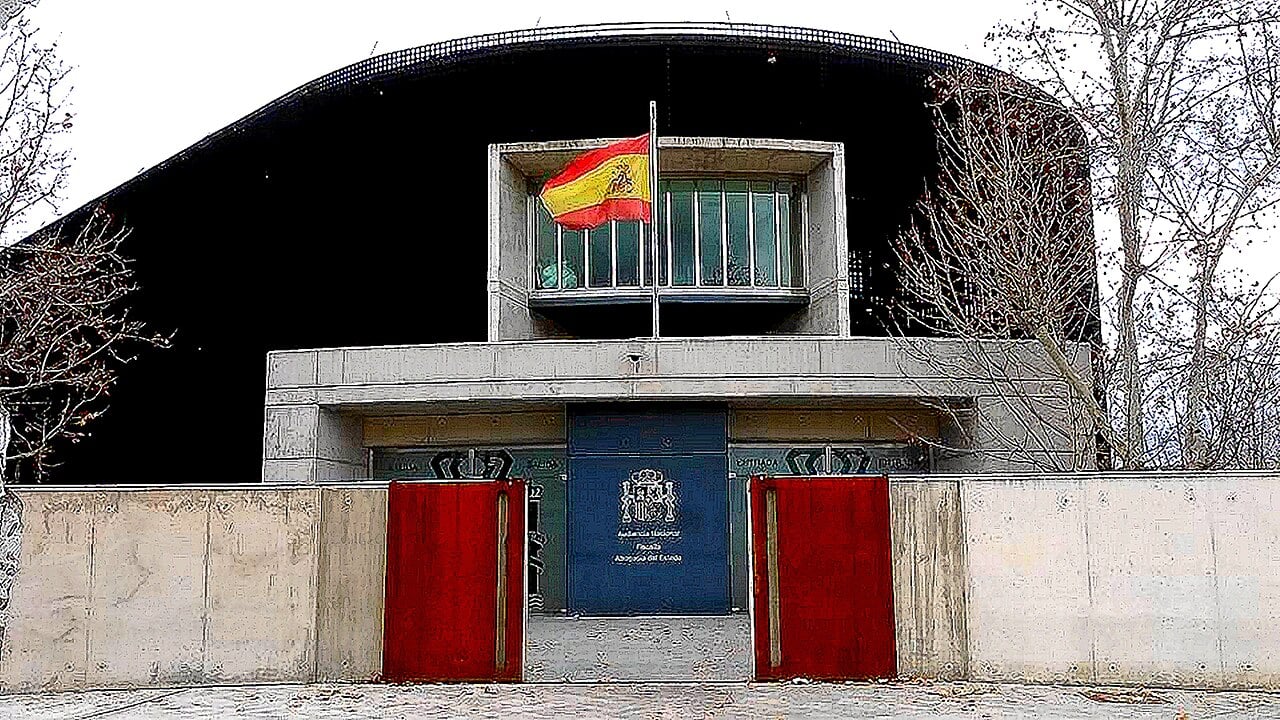 Entrance to the courtrooms of Spain’s National High Court in San Fernando de Henares near Madrid, with a Spanish flag above red gates