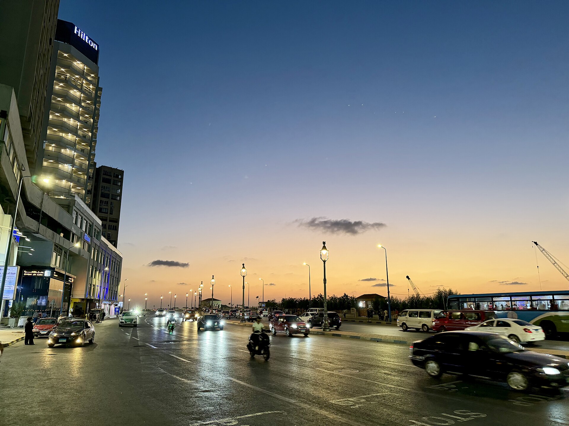 Evening traffic on the Corniche seafront road in Alexandria, Egypt