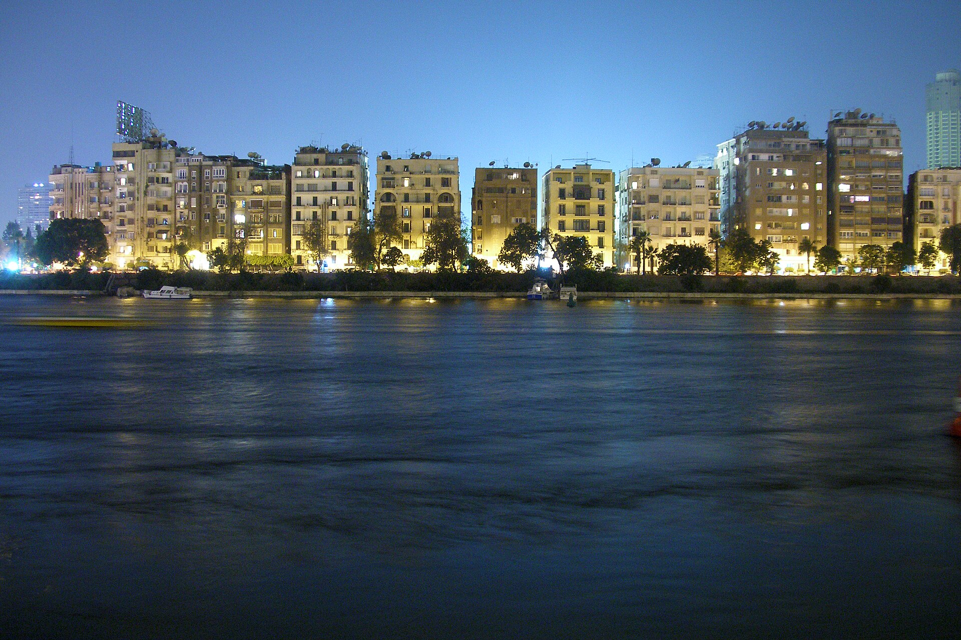 Egypt media online: apartment blocks on the Nile waterfront in Zamalek, Cairo, at night