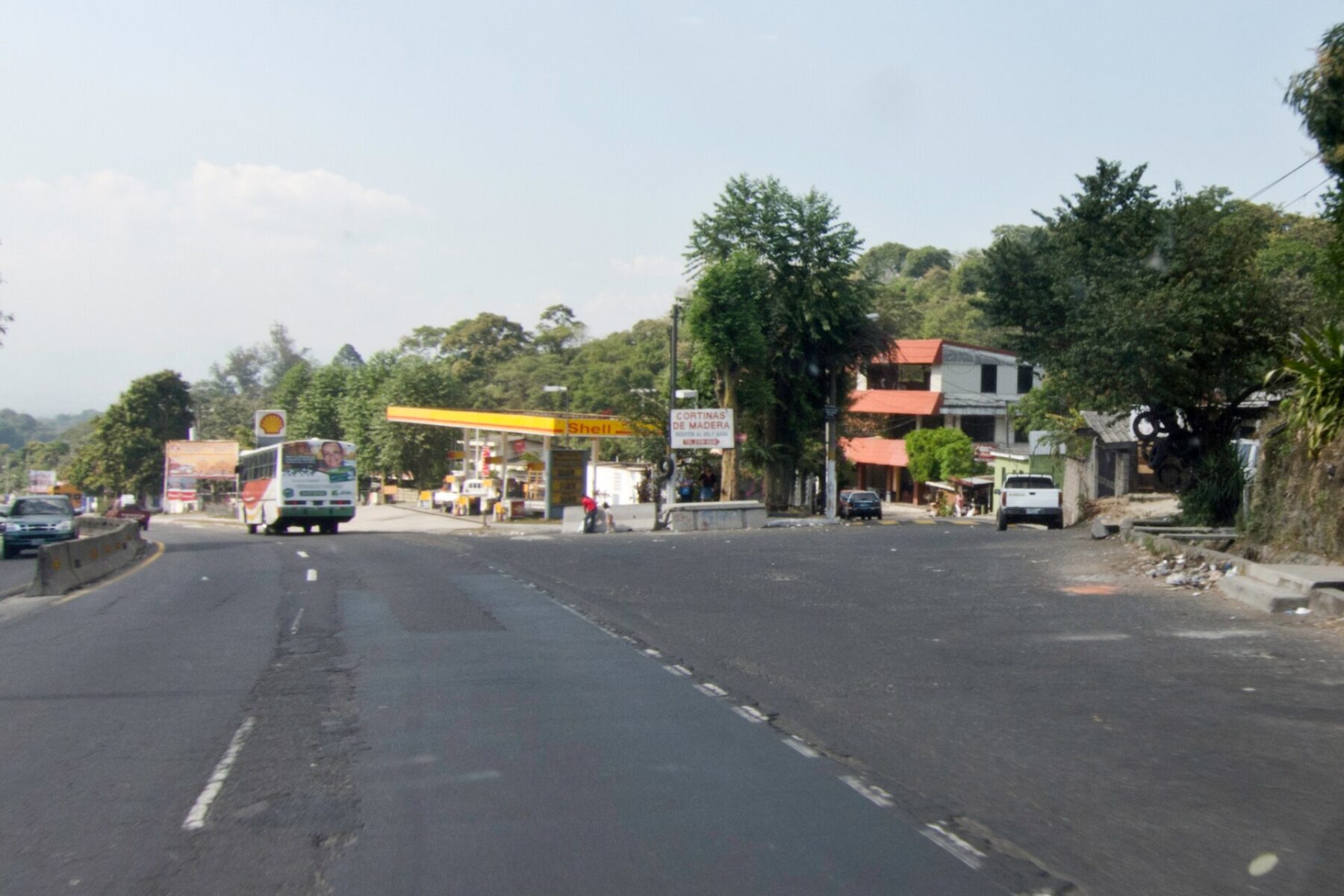 A passenger bus on the road at the entrance to Colón, La Libertad department, El Salvador