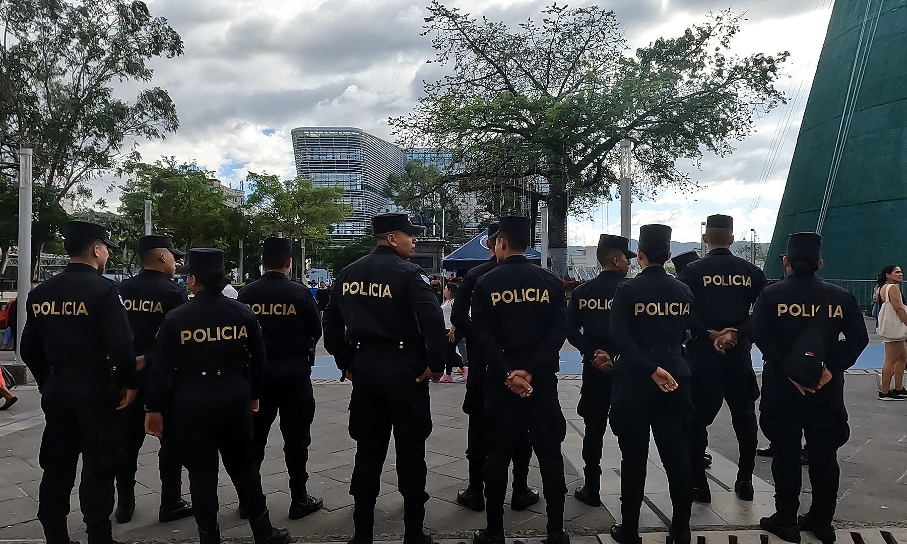 Officers of El Salvador National Civil Police standing in a row in the historic centre of San Salvador